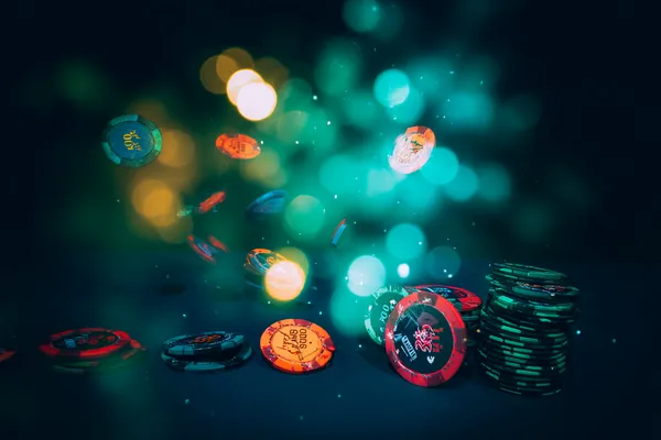 A professional dealer in a tuxedo greeting players at the roulette table, symbolizing the authentic live casino feel at ZS777.