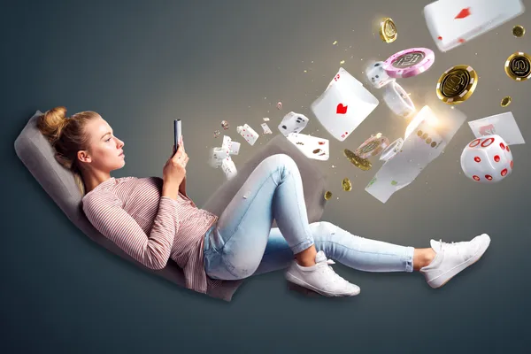 A player using their smartphone during a festive local event, representing ZS777’s fully mobile-friendly casino.